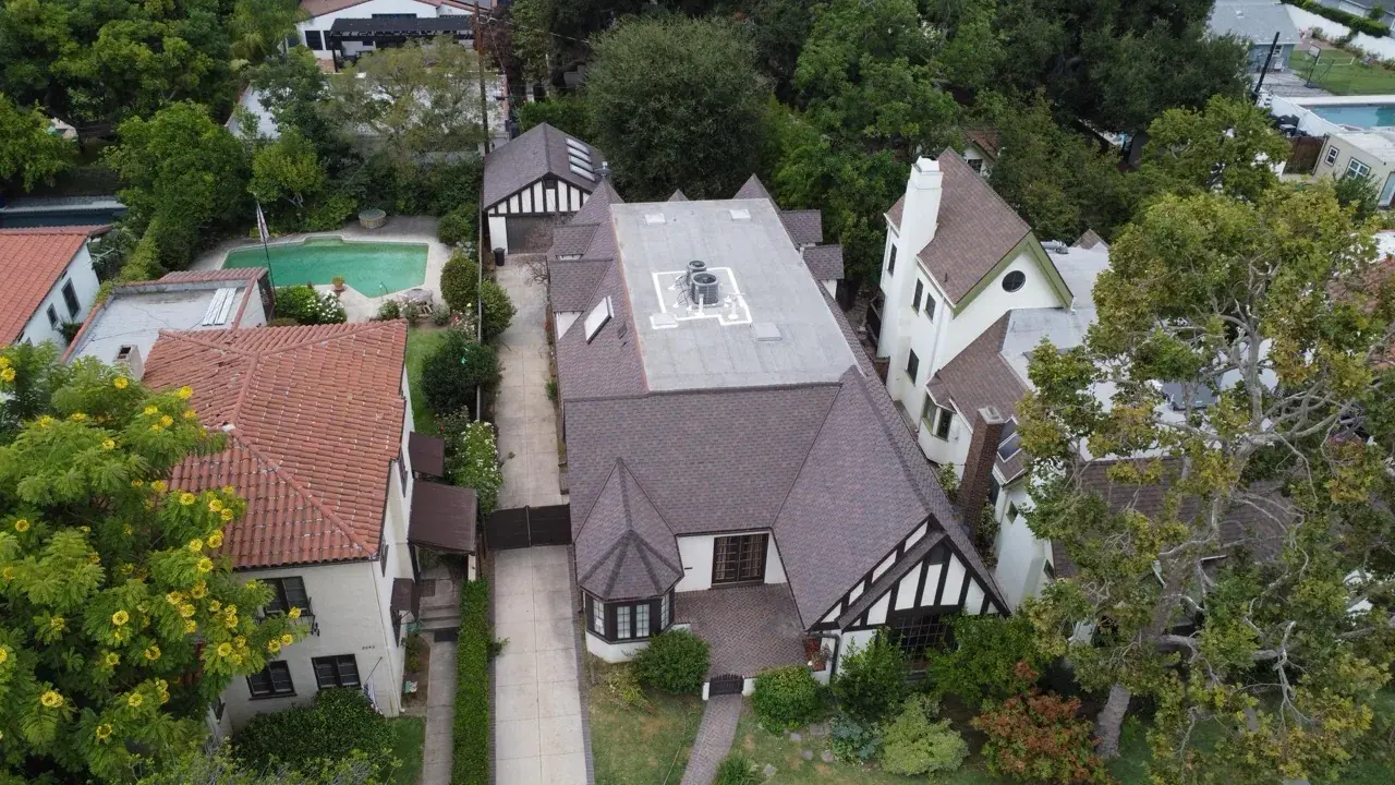 Aerial view of a completed residential shingle roof from Inclusive Roofing's portfolio