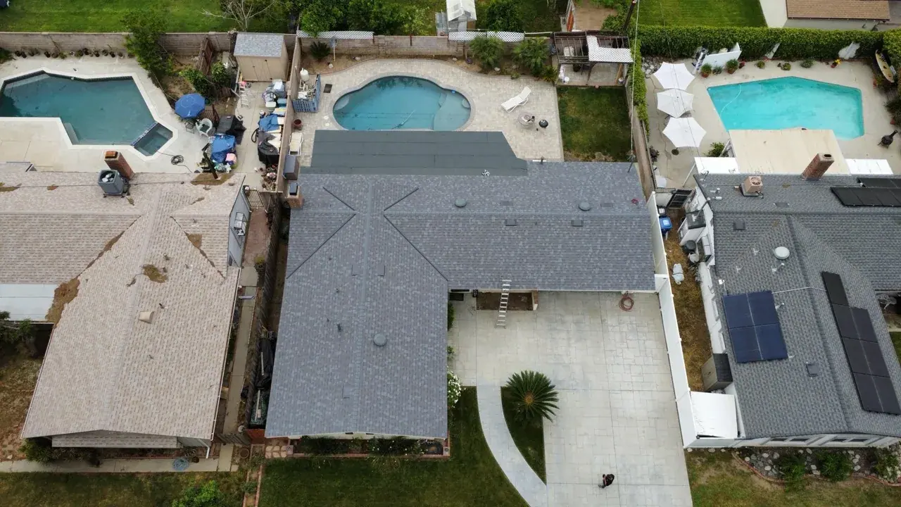 Completed residential shingle roof photographed from above
