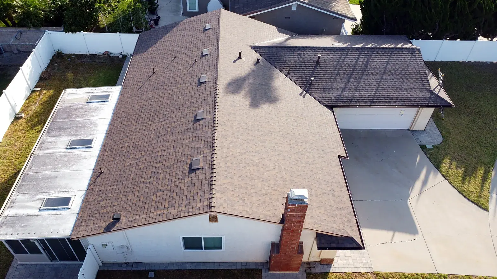 Aerial view of new shingle roof, ridge vents and attached garage in Oxnard, Ventura County