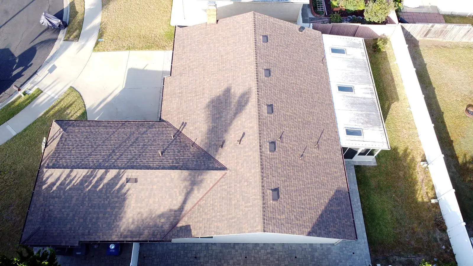 Top-down drone photo of a finished shingle roof replacement in Oxnard, CA